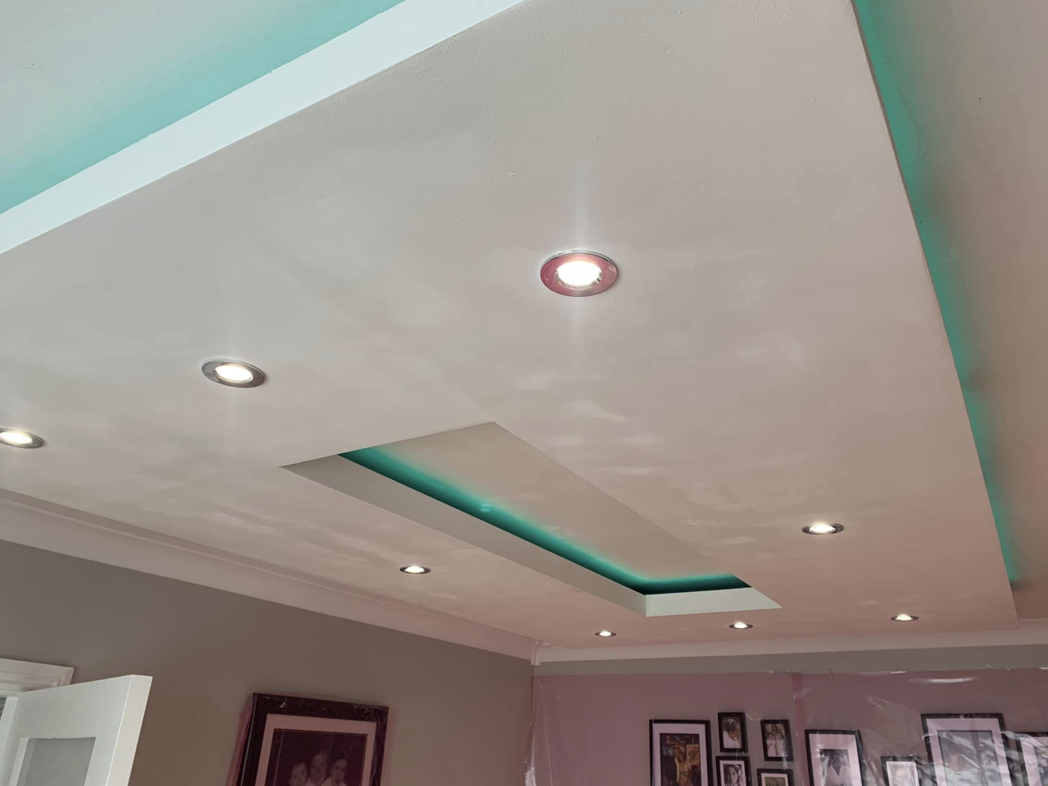Modern false ceiling installation with integrated lighting design